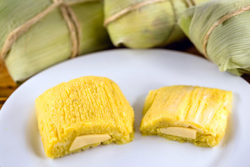 pamonha, Brazilian sweet made from homemade cheese with corn. Open pissing ready for consumption....