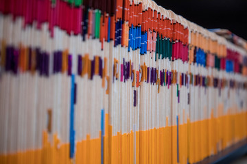 A cabinet full of files in manila folders in an office space