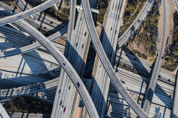Afternoon aerial above the Harbor 110 and Century 105 freeways interchange ramps in Los Angeles, California.  