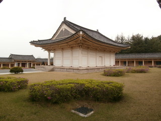 Ancient Building in traditional Asian architectures style, located in an open park.  Eastern religion. Buddimzy