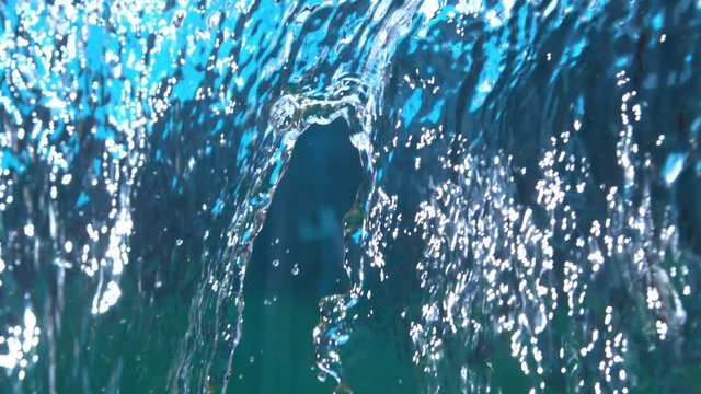 Slice of Lemon Falling in Water Waterfall Cascade with Splash in high Speed Shot at 1500 fps