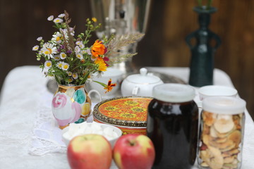 Russian tea ceremony with samovar and sweets and fruits
