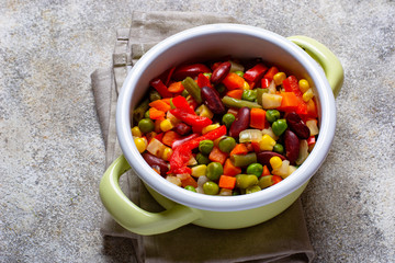 Boiled mix of vegetables in green pot