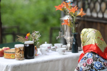 Russian tea ceremony with samovar and sweets and fruits