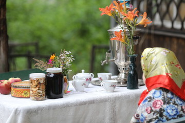 Russian tea ceremony with samovar and sweets and fruits