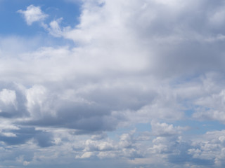 white clouds against a blue sky, abstract illustration