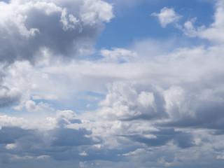 white clouds against a blue sky, abstract illustration