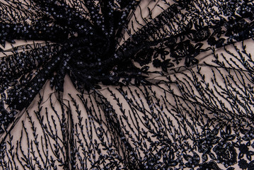 Texture lace fabric. lace on white background studio. thin fabric made of yarn or thread. a...