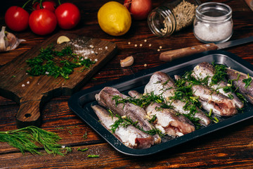 Hake carcasses on baking sheet