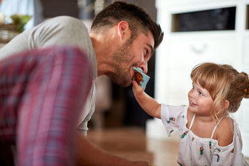 Child with her father playing and having fun