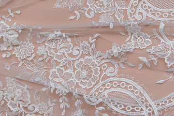 Texture lace fabric. lace on white background studio. thin fabric made of yarn or thread. a...