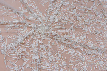 Texture lace fabric. lace on white background studio. thin fabric made of yarn or thread. a...