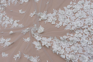 Texture lace fabric. lace on white background studio. thin fabric made of yarn or thread. a...