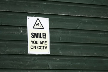 Smile you are on CCTV sign