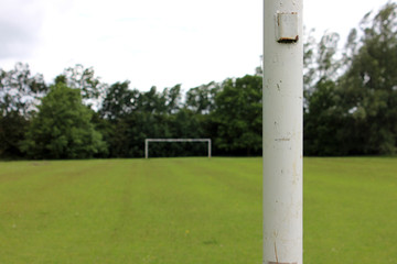 close up of a goal post from a socce rpitch