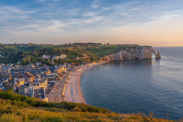 Etretat, France - 05 31 2019: Panoramic view of the cliffs of Etretat and the city at sunset