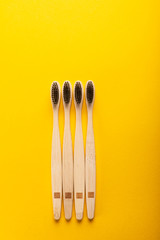 A family set of four wooden bamboo toothbrushes