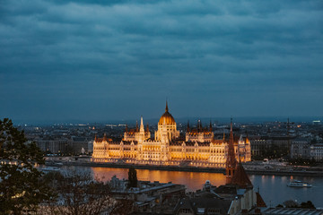 Fototapeta na wymiar Budapest parliament night yellow illumination river bank