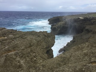 Wide shot of the As Matmos Fishing Cliff, Rota, Northern Mariana Islands
