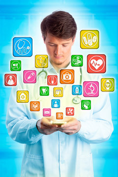 Young Doctor Navigating Healthcare Apps On Mobile