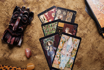 Spelling Tarot with devil figure. studio shot