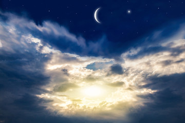 Obraz na płótnie Canvas New moon . Religion background . The sky at night with stars. Ramadan background . Prayer time . 