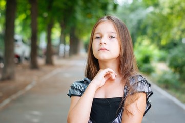 Little cute girl street city lifestyle shooting, summer, smiling at camera