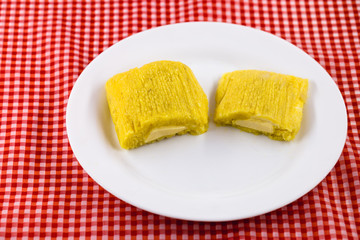 Pamonha, Brazilian sweet corn with cheese filling. Pamonha typical of Brazil, food of the state of minas gerais and goiais. Concept of traditional food. Brazilian food at rural parties