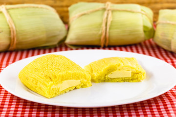 Pamonha, Brazilian sweet corn with cheese filling. Pamonha typical of Brazil, food of the state of minas gerais and goiais. Concept of traditional food. Brazilian food