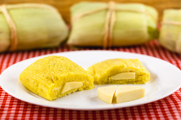 Pamonha, Brazilian sweet corn with cheese filling. Pamonha typical of Brazil, food of the state of minas gerais and goiais. Concept of traditional food. Brazilian food