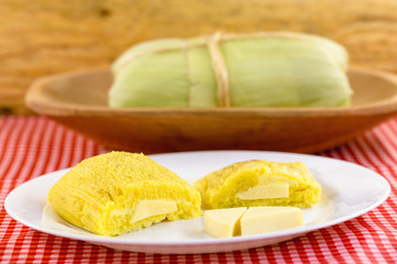 Pamonha, Brazilian sweet corn with cheese filling. Pamonha typical of Brazil, food of the state of minas gerais and goiais. Concept of traditional food. Brazilian food
