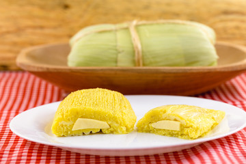 Pamonha, Brazilian sweet corn with cheese filling. Pamonha typical of Brazil, food of the state of minas gerais and goiais. Concept of traditional food. Brazilian food