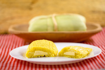 Pamonha, Brazilian sweet corn with cheese filling. Pamonha typical of Brazil, food of the state of minas gerais and goiais. Concept of traditional food. Brazilian food