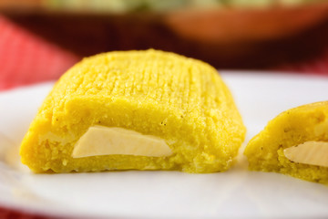 Pamonha, Brazilian sweet corn with cheese filling. Pamonha typical of Brazil, food of the state of minas gerais and goiais. Concept of traditional food. Brazilian food