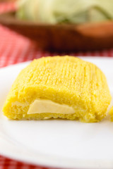 Pamonha, Brazilian sweet corn with cheese filling. Pamonha typical of Brazil, food of the state of minas gerais and goiais. Concept of traditional food. Brazilian food