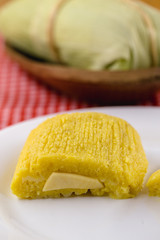 Pamonha, Brazilian sweet corn with cheese filling. Pamonha typical of Brazil, food of the state of minas gerais and goiais. Concept of traditional food. Brazilian food