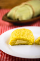 Pamonha, Brazilian sweet corn with cheese filling. Pamonha typical of Brazil, food of the state of minas gerais and goiais. Concept of traditional food. Brazilian food