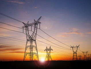 electricity pylons at sunset - 278124484