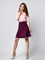 Fototapeta premium A successful young businesswoman, isolated on white background