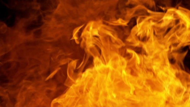 Super slow motion of fire blast isolated on black background. Filmed on high speed cinema camera, 1000 fps