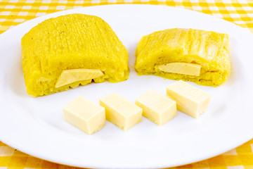 pamonha, Brazilian sweet made from homemade cheese with corn. Open pissing ready for consumption....