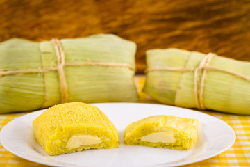 pamonha, Brazilian sweet made from homemade cheese with corn. Open pissing ready for consumption. Concept of traditional Brazilian sweet, typical food of the months of June and July.