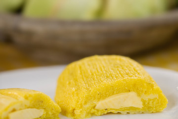 pamonha, Brazilian sweet made from homemade cheese with corn. Open pissing ready for consumption. Concept of traditional Brazilian sweet, typical food of the months of June and July.