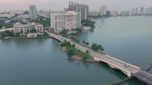 Aerial: Condominiums along venetian causeway in Miami Beach. In the background is South Beach, Miami. Florida