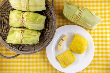 pamonha, Brazilian sweet made from homemade cheese with corn. Open pissing ready for consumption. Concept of traditional Brazilian sweet, typical food of the months of June and July.