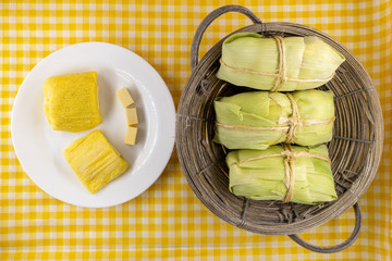 pamonha, Brazilian sweet made from homemade cheese with corn. Open pissing ready for consumption....