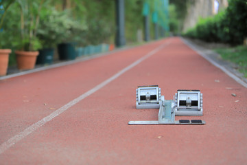Athletics Starting Blocks and red running tracks in stadion