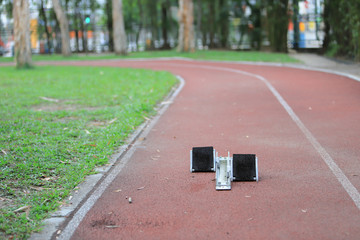 Athletics Starting Blocks and red running tracks in stadion