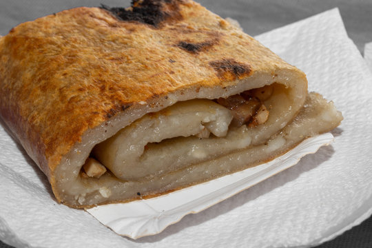 Traditional potato bread CHOCHOCA from Chiloe Island Chile prepared on wooden stick