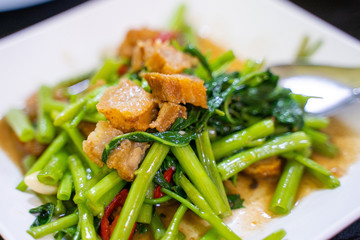 stir fried crispy pork with morning glory